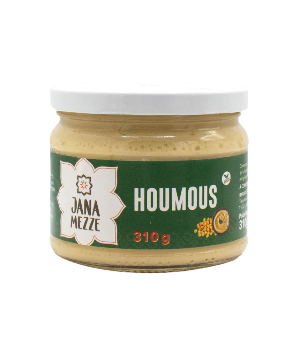 A jar of Jana Mezze hummus weighing 390 grams, with a white lid and a label displaying the brand name and product weight.